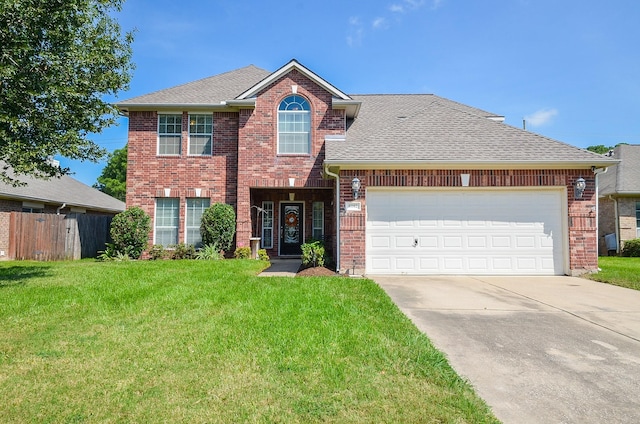 view of front property with a garage and a front lawn