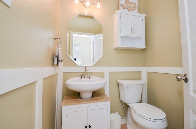 bathroom with sink and toilet