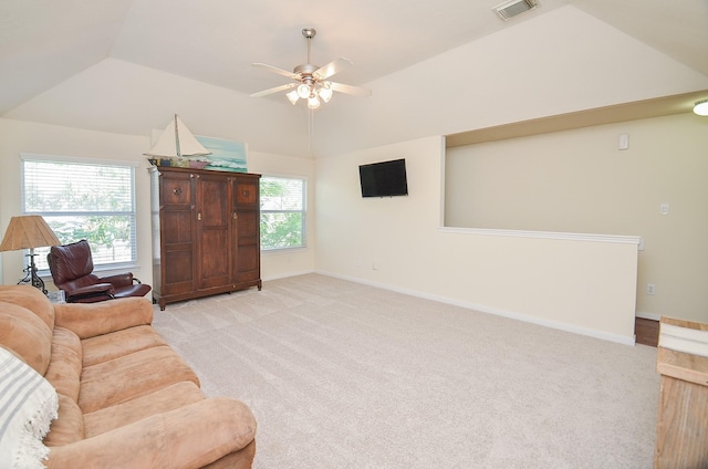 carpeted living room with vaulted ceiling and ceiling fan