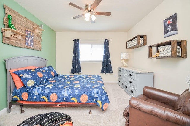 bedroom featuring light colored carpet and ceiling fan