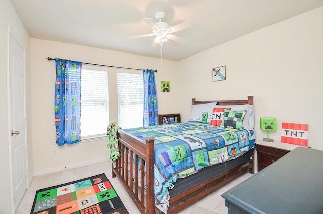 bedroom featuring ceiling fan and light colored carpet