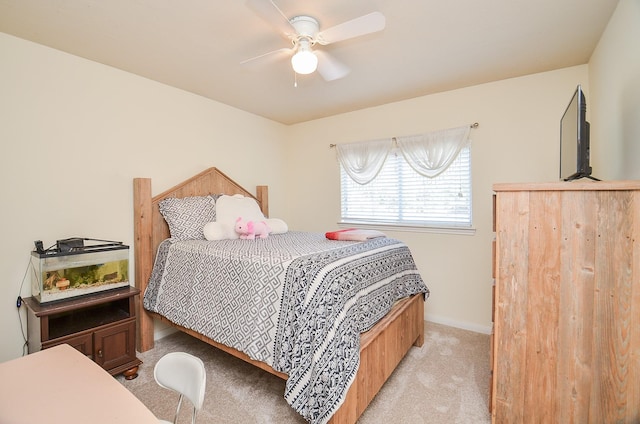 bedroom featuring light carpet and ceiling fan