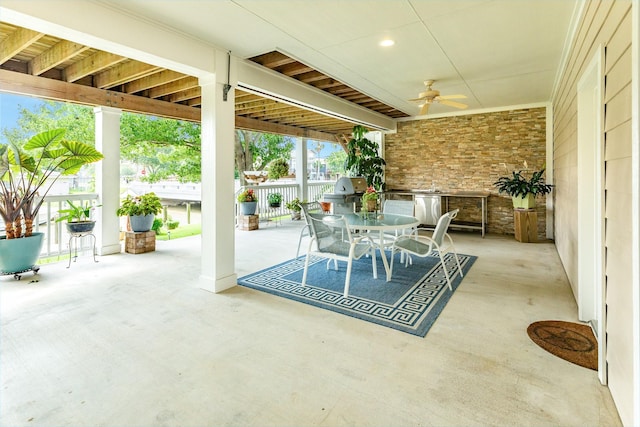 view of patio featuring area for grilling and ceiling fan