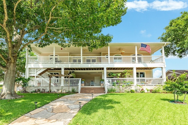 back of property featuring a porch and a lawn