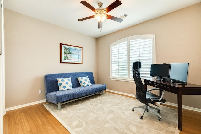 office space with hardwood / wood-style flooring and ceiling fan