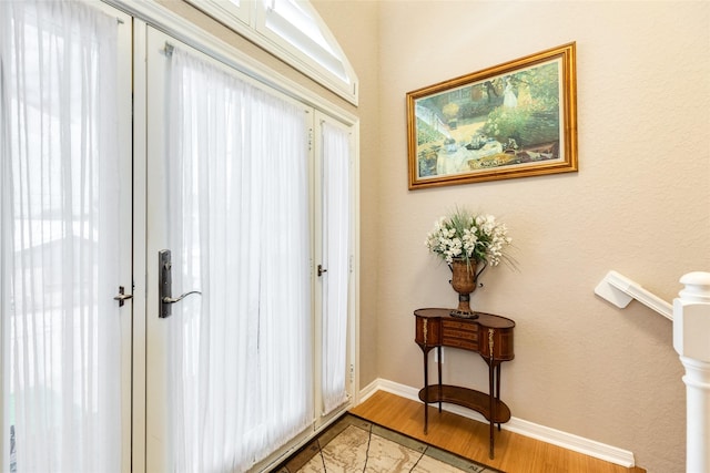 doorway with light wood-type flooring