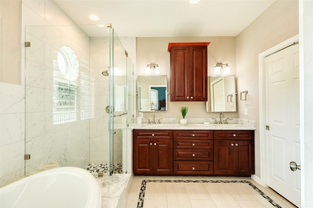 bathroom with vanity, tile patterned floors, and plus walk in shower