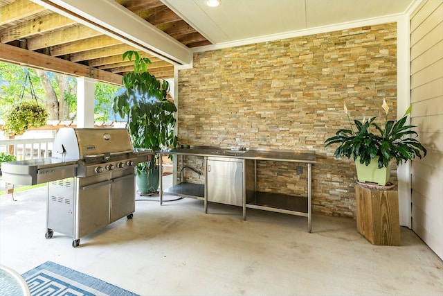 view of patio / terrace with an outdoor kitchen and sink