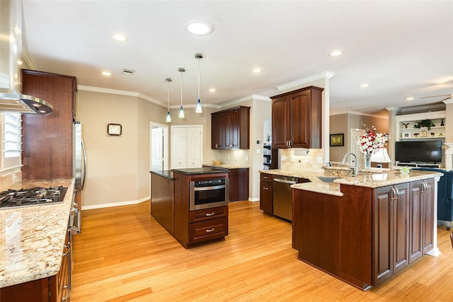 kitchen featuring stainless steel appliances, sink, a kitchen island, and island range hood