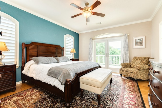 bedroom with access to exterior, wood-type flooring, ornamental molding, and ceiling fan