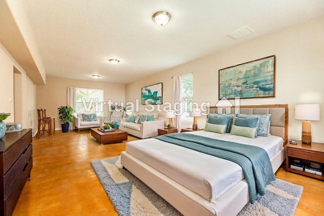 bedroom featuring multiple windows