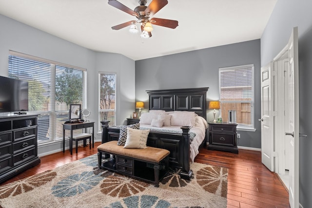 bedroom with ceiling fan and dark hardwood / wood-style flooring