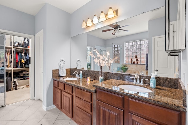 bathroom with ceiling fan, vanity, and tile patterned flooring