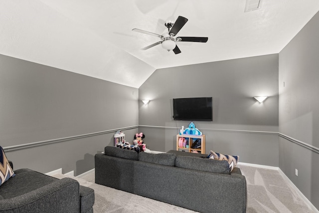 carpeted living room featuring ceiling fan and vaulted ceiling