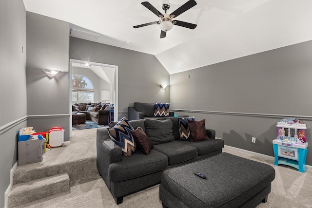 living room with vaulted ceiling, ceiling fan, and carpet floors