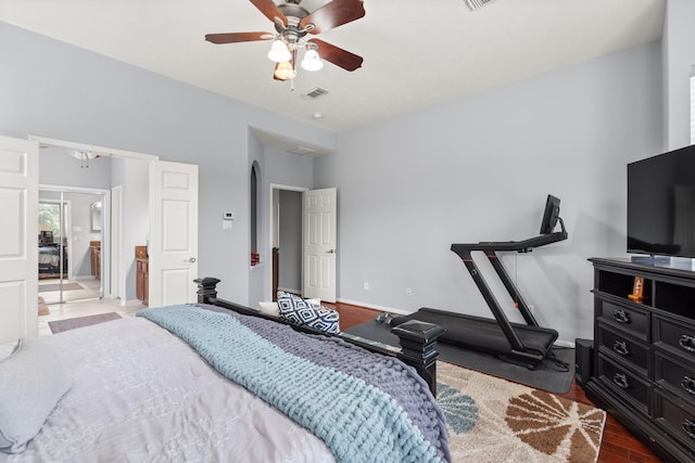 bedroom with ceiling fan and wood-type flooring