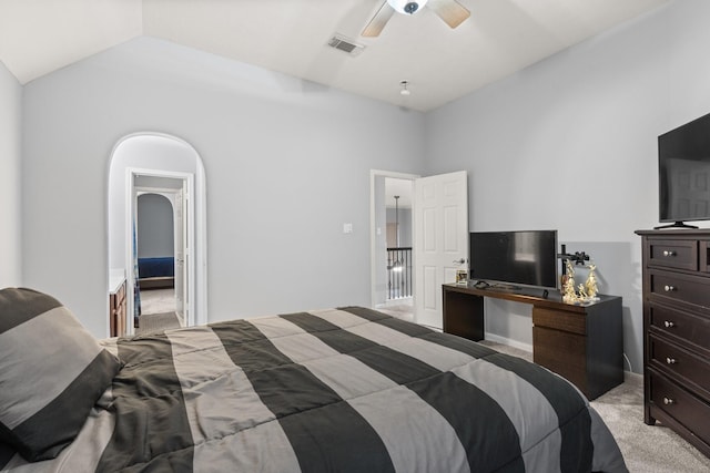 bedroom with vaulted ceiling, light carpet, and ceiling fan