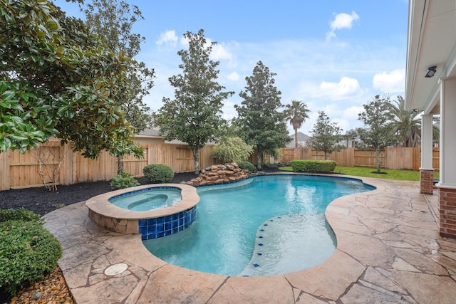 view of swimming pool with an in ground hot tub and a patio