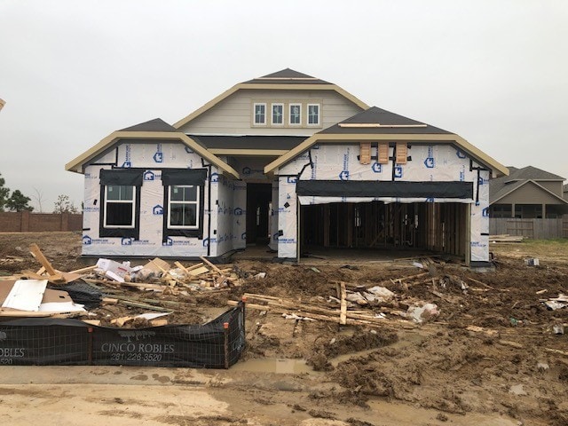 unfinished property featuring an attached garage