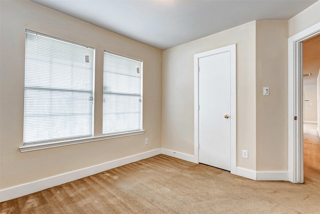 unfurnished bedroom with light carpet