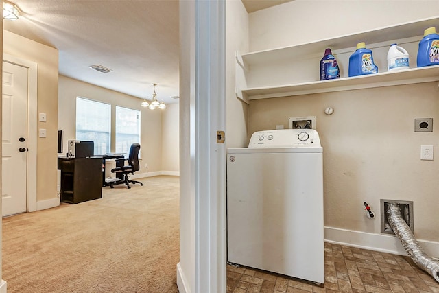 laundry room with washer / clothes dryer, carpet flooring, and a notable chandelier