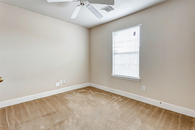 carpeted empty room with ceiling fan