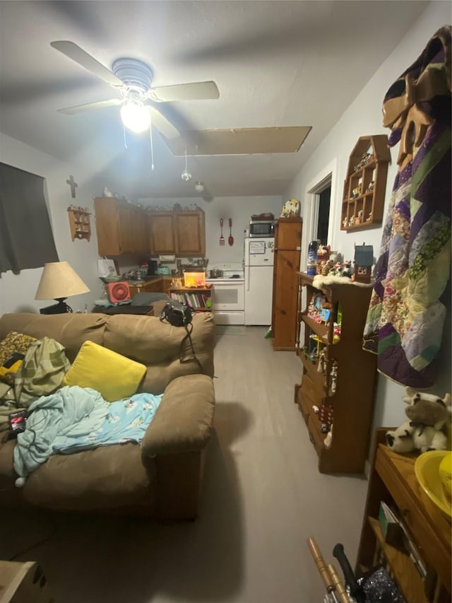 living room featuring ceiling fan and light hardwood / wood-style flooring