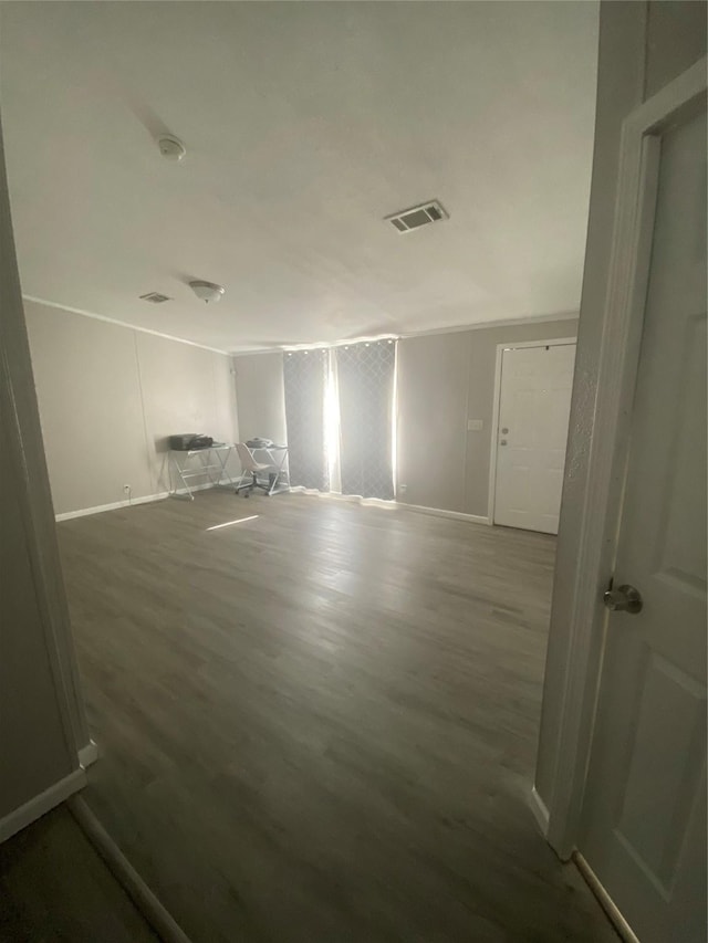 unfurnished room with hardwood / wood-style floors