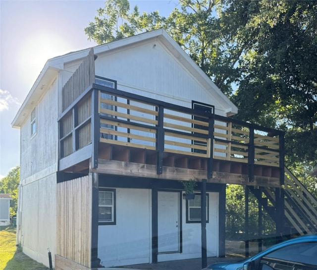 rear view of property with a deck