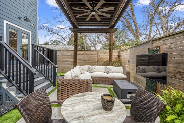 view of patio featuring ceiling fan and an outdoor living space