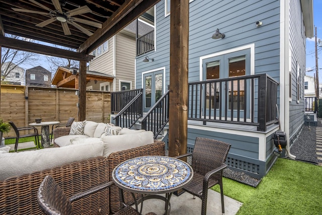 view of patio / terrace with outdoor lounge area, french doors, and ceiling fan