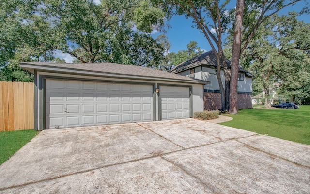 garage featuring a lawn