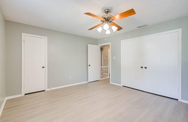 unfurnished bedroom featuring light hardwood / wood-style flooring and ceiling fan