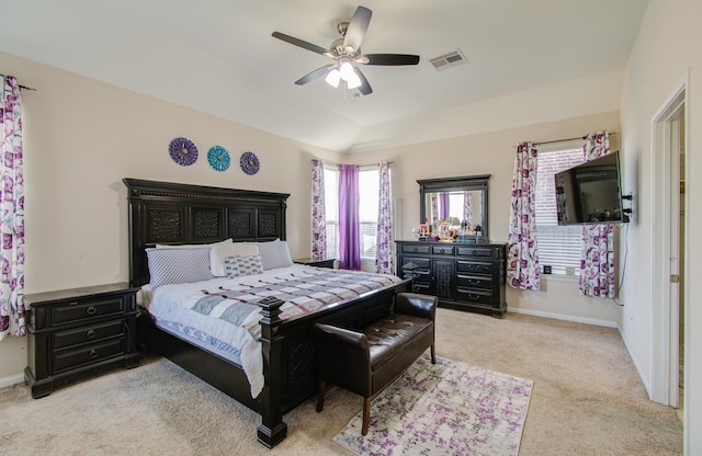 carpeted bedroom featuring ceiling fan and lofted ceiling