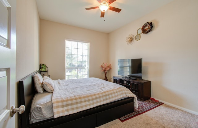 bedroom with ceiling fan and carpet floors