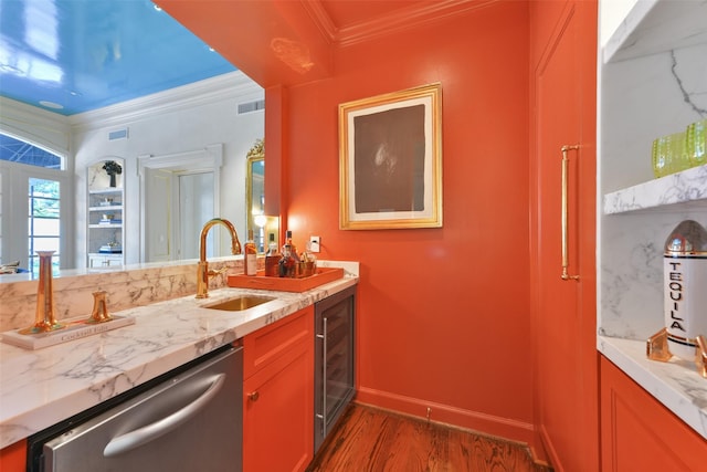 kitchen featuring visible vents, wine cooler, ornamental molding, stainless steel dishwasher, and a sink