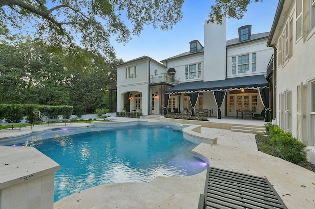 view of pool featuring a patio