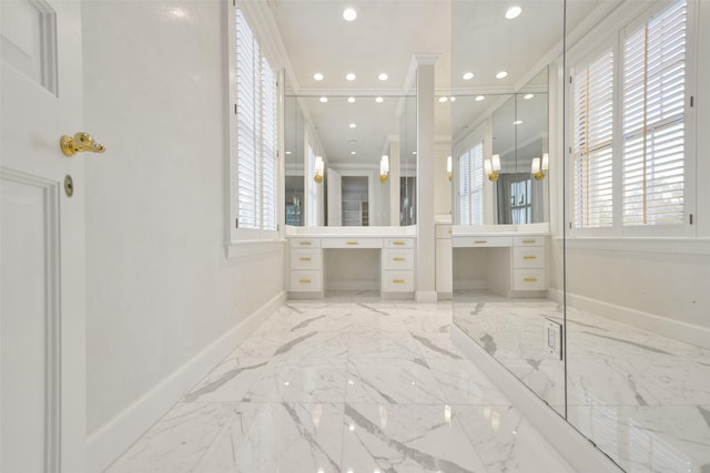 bathroom featuring crown molding, vanity, and an enclosed shower