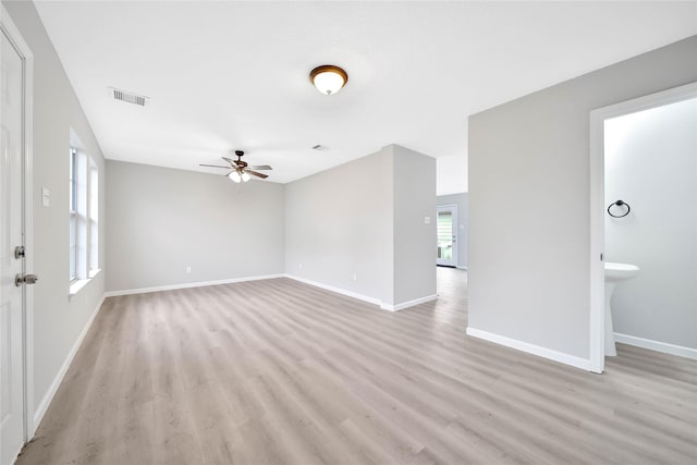 unfurnished living room with light hardwood / wood-style flooring and ceiling fan