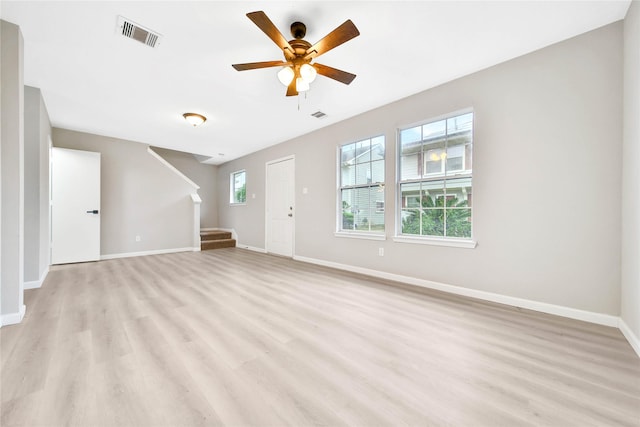 unfurnished living room with ceiling fan and light hardwood / wood-style floors