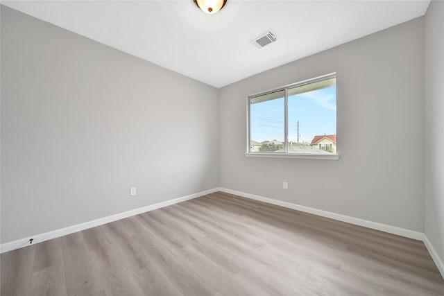 unfurnished room with light hardwood / wood-style flooring