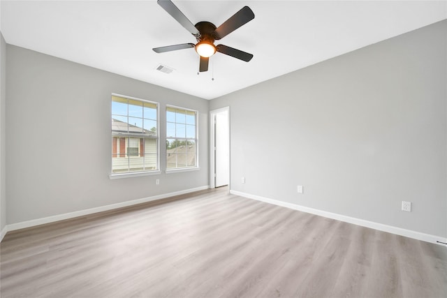 unfurnished room featuring ceiling fan and light hardwood / wood-style floors