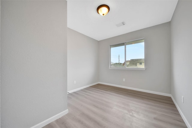 unfurnished room with light hardwood / wood-style flooring