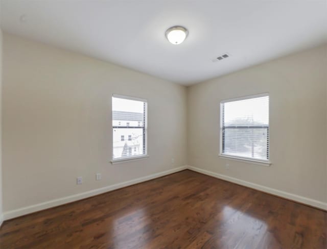 empty room featuring dark hardwood / wood-style floors