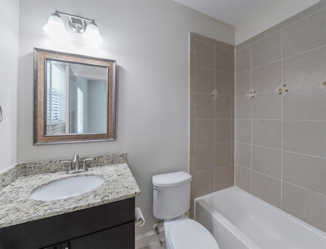 full bathroom featuring vanity, toilet, and tiled shower / bath combo