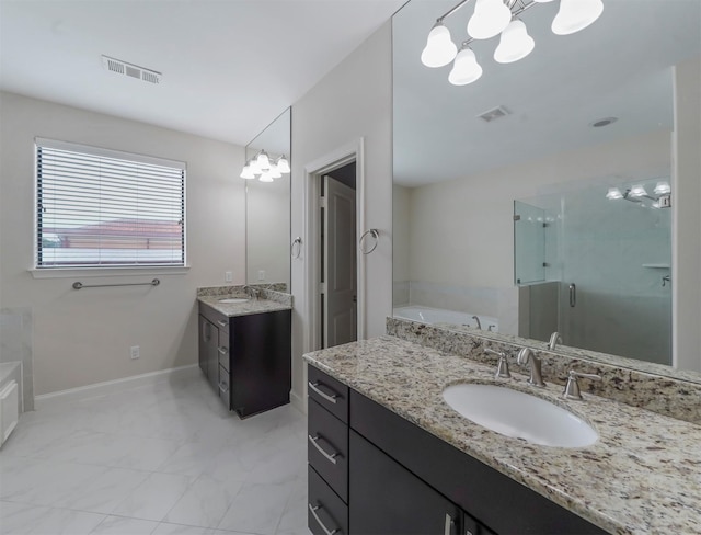 bathroom featuring vanity and shower with separate bathtub