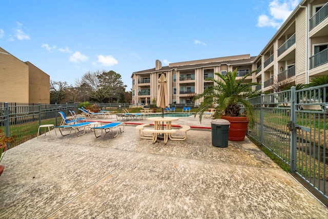 view of home's community with a patio area