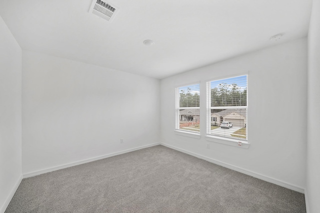 spare room featuring carpet floors