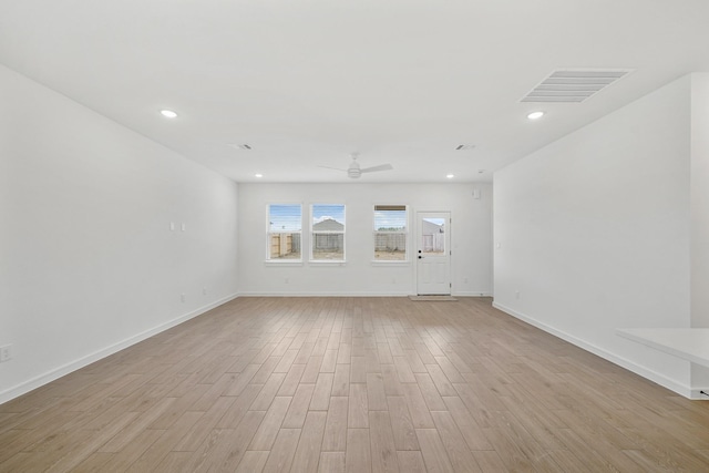 spare room featuring ceiling fan and light wood-type flooring