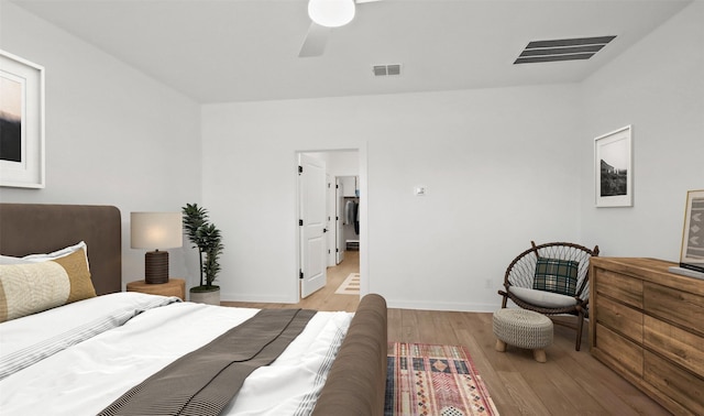 bedroom featuring ceiling fan and light hardwood / wood-style flooring